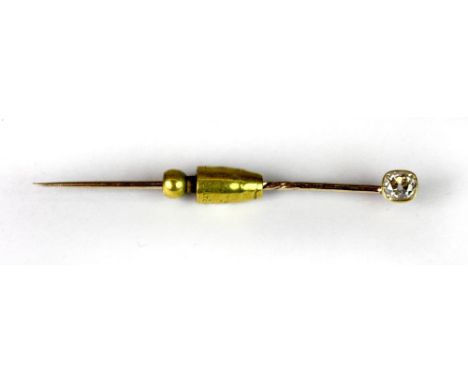 A 9ct yellow gold tie pin set with a cushion cut diamond.