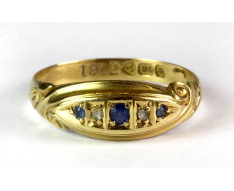 An 18ct yellow gold diamond and sapphire set ring (R).