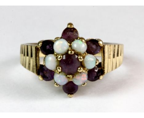 A 9ct yellow gold opal and amethyst cluster ring (Q).