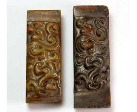 A pair of early 20th century Chinese carved stone scroll weights, L. 8 & 7cm.