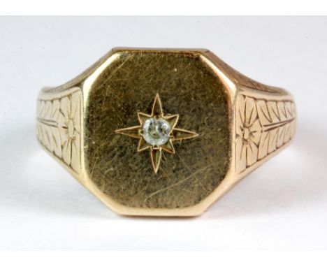 A 9ct yellow gold gentleman's signet ring set with a single diamond (R.5).