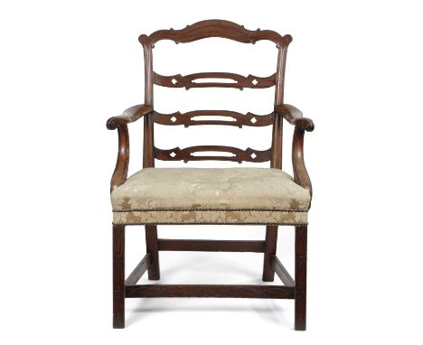 AN EARLY GEORGE III MAHOGANY OPEN ARMCHAIRC.1760-70the frame decorated with bead mouldings, the ladder back pierced with quat