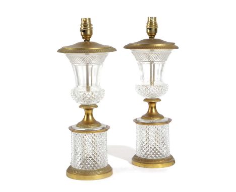 A PAIR OF FRENCH CUT GLASS AND ORMOLU MOUNTED TABLE LAMPSLATE 19TH CENTURYof thistle form, on a socle base and cylindrical pl