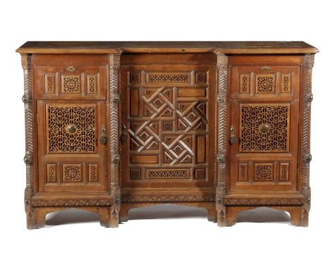 A MOORISH HARDWOOD AND CEDAR SIDE CABINET IN ARTS AND CRAFTS LIBERTY STYLE, LATE 19TH / EARLY 20TH CENTURYthe panelled invert