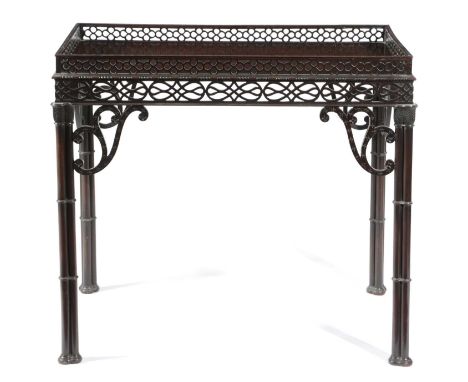 A MAHOGANY SILVER TABLE IN CHINESE CHIPPENDALE STLYE, 19TH CENTURYwith a pierced quatrefoil gallery on cluster column legs wi