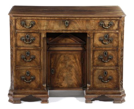 AN EARLY GEORGE III MAHOGANY KNEEHOLE DESKIN THE MANNER OF GILLOWS, C.1760-70the rectangular moulded top with canted front co