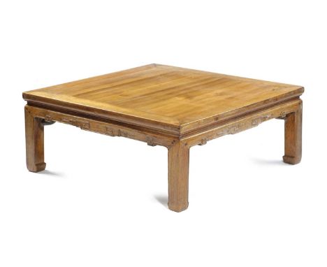 A CHINESE ELM MAHJONG OR LOW TABLEthe panelled top above a key-carved frieze37cm high, 91cm square