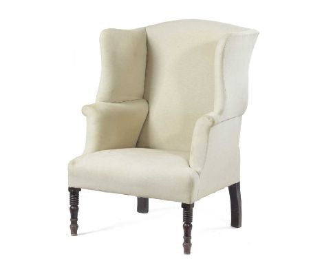 A WING ARMCHAIRIN GEORGE III STYLE, 19TH CENTURYon ring turned front legs