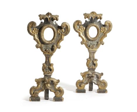 A PAIR OF ITALIAN GILTWOOD AND EBONISED BAROQUE RELIQUARIES18TH CENTURYeach with scrolling and foliate decoration around a ce