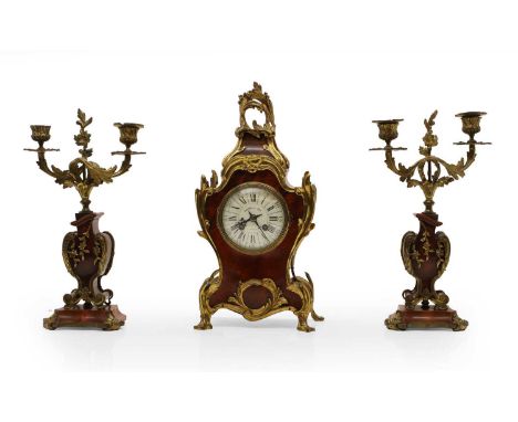 A Louis XV style tortoiseshell mantel clock the enamel dial with Roman and Arabic numerals, marked 'Lawson &amp; Son', with a