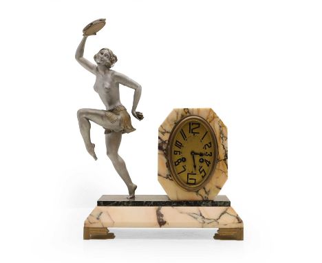 An Art Deco French marble and spelter clock in the style of Guiraud Riviere, the dial with oval face, with Arabic numerals, w