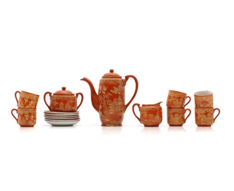 A Japanese porcelain coffee service, 20th century, comprising a coffee pot, 18cm high, a sugar bowl and cover, 12cm wide a cr