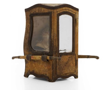A model of a sedan chair, 20th century, mounted with machine embroidered panels, the glass bevelled,14.5cm wide 16cm deep29.5