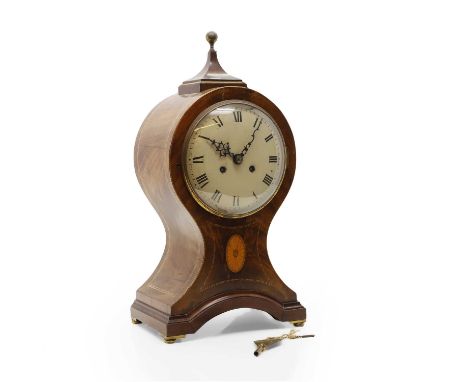A large Edwardian inlaid mahogany mantel clock the circular dial with Roman numerals and gong strike movement within a 'ballo