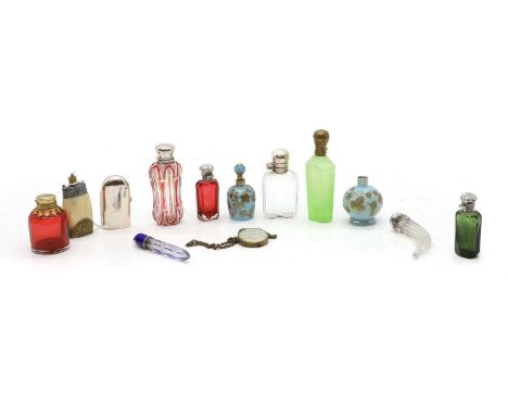 A collection of glass scent bottles, predominately mid to late 19th century, to include silver-mounted examples, including a 