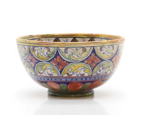 Alfredo Santarelli (Italian, 1874-1957) a faience lusterware bowl, with portrait of a saint to the interior, foliate and flor