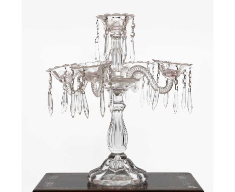 A cut glass three branch candelabra, the triple scalloped sconces on scrolling branches and fluted stems, 36cm highCondition 