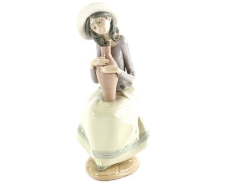 A Nao porcelain figure, Girl with Flagons, model number 02001360, 28cm high.