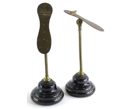 A pair of Victorian Harris and Sheldon Birmingham shoe stands, each on a leaf moulded column and black glazed ceramic base, 3