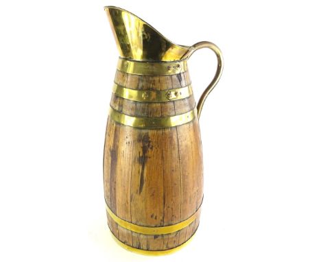 An oak and brass coopered large flagon or stick stand, 68cm high.