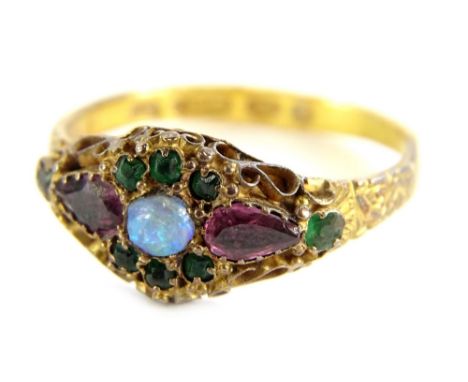 A Victorian dress ring, set with opal, emerald and amethyst, with filigree type scrolling and etched band, ring size R, 2.1g 