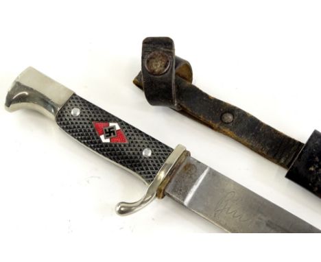 A Hitler Youth dagger, the blade engraved Blut Und EHRE!, MZ/49,1939, with enamel emblem to handle, black and metal and leath