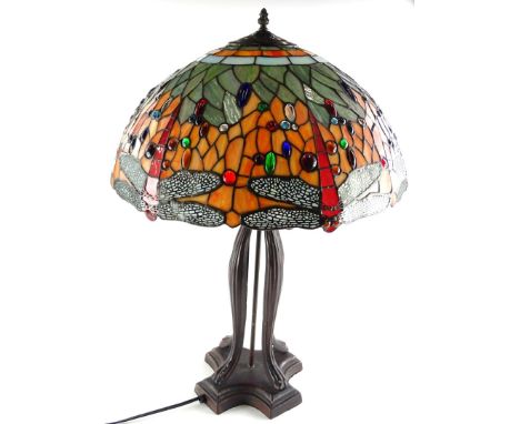 A Tiffany style lamp base, a shade decorated with coloured glass cabochon, dragonflies etc., on a bronzed base with concave p