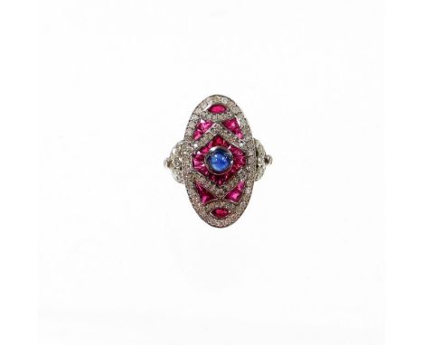 An Art Deco style ruby, diamond and sapphire cocktail ring, with arrangement of baguette cut rubies and round brilliant cut d