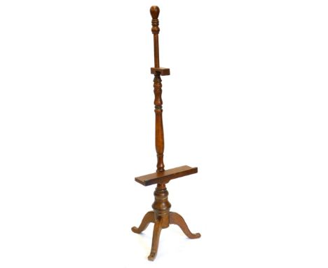 An American MDF easel, stained to replicate timber, on a tripod base, 153cm high.