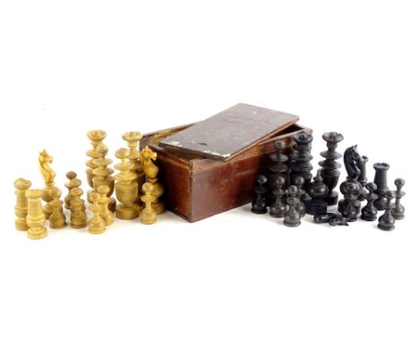A turned wooden chess set, part stained black, in fitted box, the largest piece 9cm high.