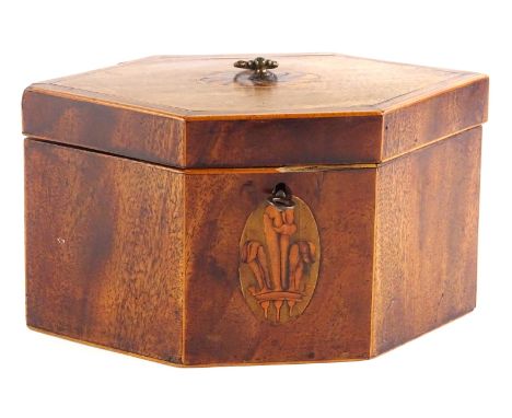 A George III mahogany and boxwood strung tea caddy, of elongated hexagonal form, the hinged lid with a marquetry oval enclosi