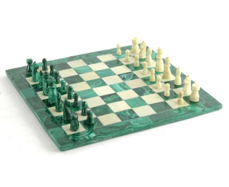 An onyx and white alabaster chess set and board, 29cm square.