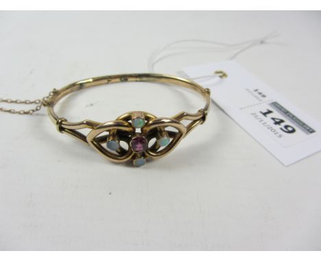 Edwardian hinged bangle set with ruby and opals stamped 9ct