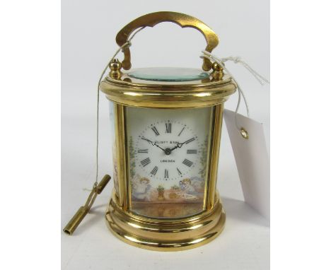 Miniature round carriage clock with painted enamel panels, inscribed Elliott & Sons London