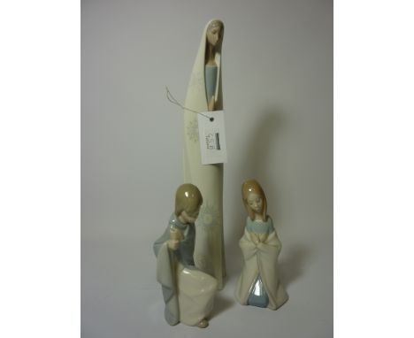 Lladro figure of a woman praying and two Lladro figures of children (3) H35cm