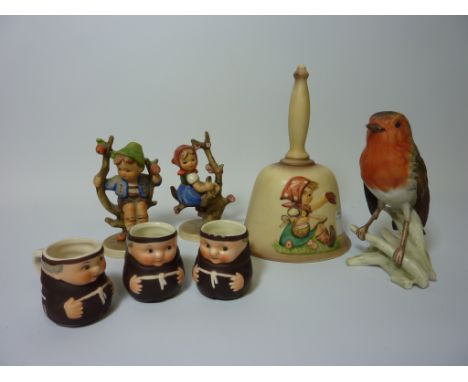 Two Hummel figures H9.5cm, decorative bell, three miniature monk jugs and a Goebel robin(7)