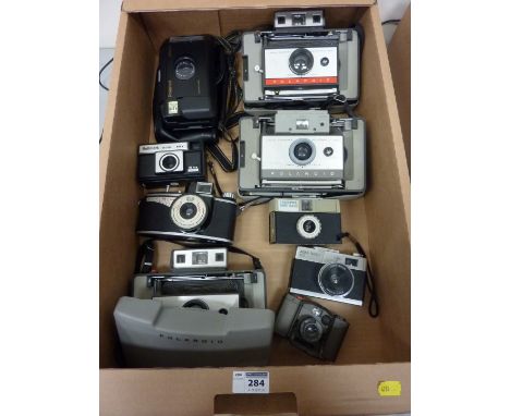 Vintage Polaroid and Vintage 35mm camera in one box.