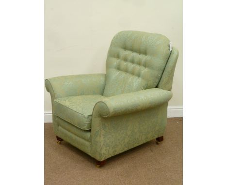 Vale Petite armchair upholstered in Gerziana green button back fabric with loose cushion with mahogany feet and brass castors