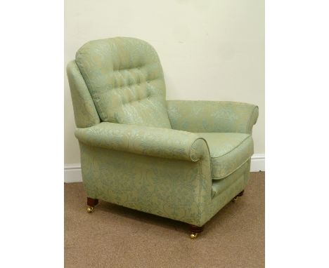 Vale Petite armchair upholstered in Gerziana green button back fabric with loose cushion with mahogany feet and brass castors