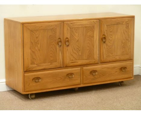 Ercol light elm three door sideboard fitted with two drawers to base, W130cm, H76cm, D45cm