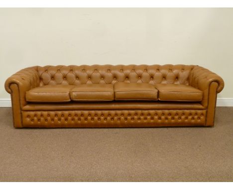 Large four seat Chesterfield sofa upholstered in buttoned tan faux leather, W245cm