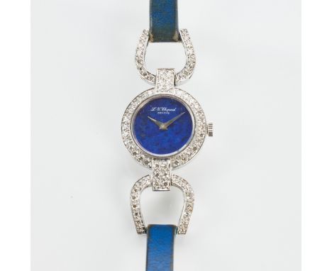 Elegante CHOPARD - Damenarmbanduhr mit LapislazuliFa. Chopard Genève. 750/- Weißgold. Gewicht: 19,7 g. Gehäuse-D. 2 cm. L. 15