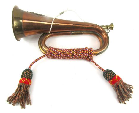 A copper bugle, bearing crest of Argyle and Sutherland, with rope twist handle, 31cm wide. 