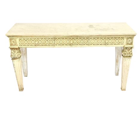 A Neoclassical style marble topped and cream painted console, with two floral carved friezes, raised on leaf carved and flute