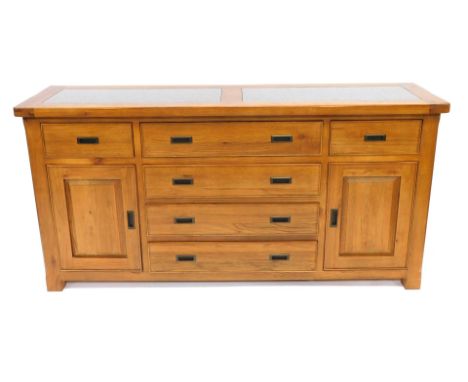 A G Plan light oak and grey marble topped sideboard, with four long central drawers, flanked by two further drawers above cup