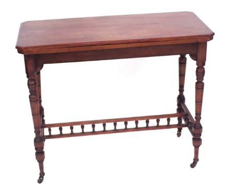 A late 19thC walnut card table, the rectangular top with canted corners, on a turned column, with spindle turned H stretcher,