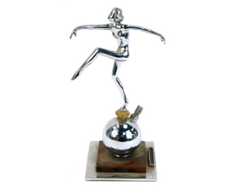 An Art Deco chrome figural table lighter, in the form of a nude female dancer, raised on a spherical reservoir with match str