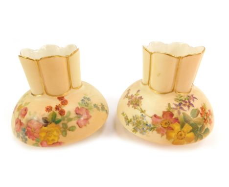 A pair of Royal Worcester blush porcelain vases, c1901, of crenellated compressed form, shape 991, painted with sprays of flo