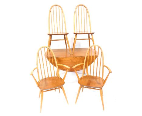 A set of four Ercol stick back dining chairs and a circular drop leaf table, each with an elm solid seat, on turned tapering 