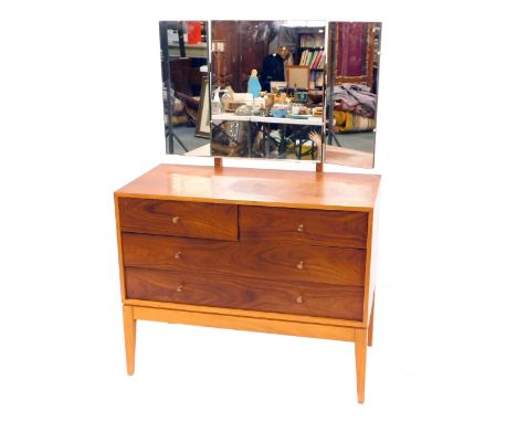 A mid century Uniflex dark and light teak dressing chest, with a glass triptych mirror, over two short above two long drawers